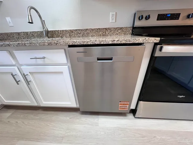 a kitchen with a sink and a microwave