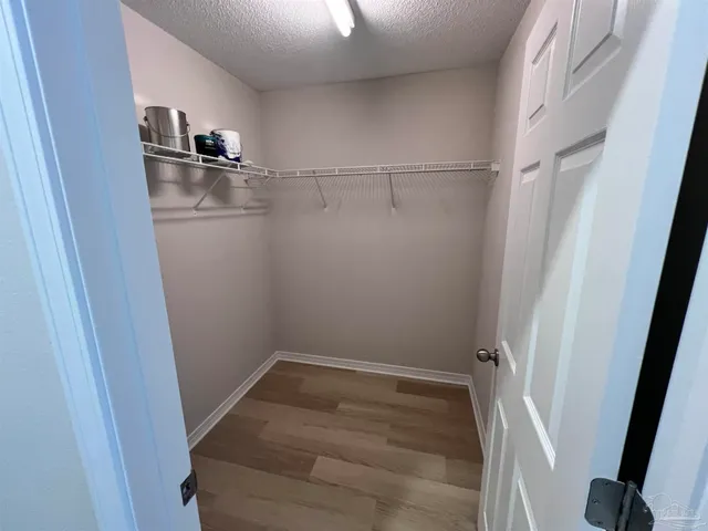 a view of a room with racks on the wall