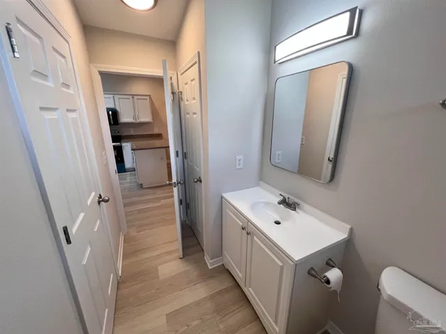 a bathroom with a sink a mirror and a toilet