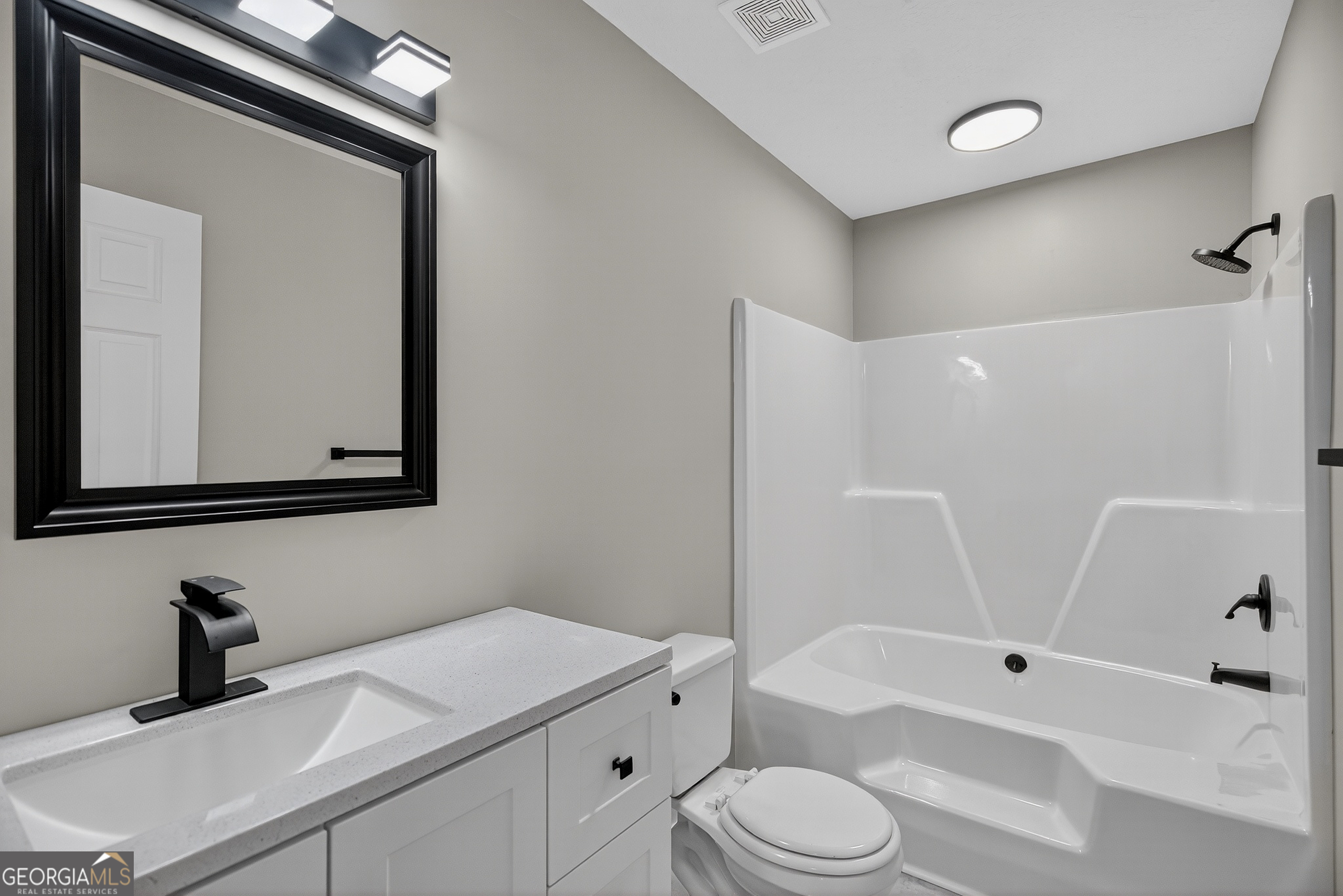 105 Ridgefield Drive LaGrange, GA 30241 - Photo 13 of 18 a bathroom with a sink toilet and shower