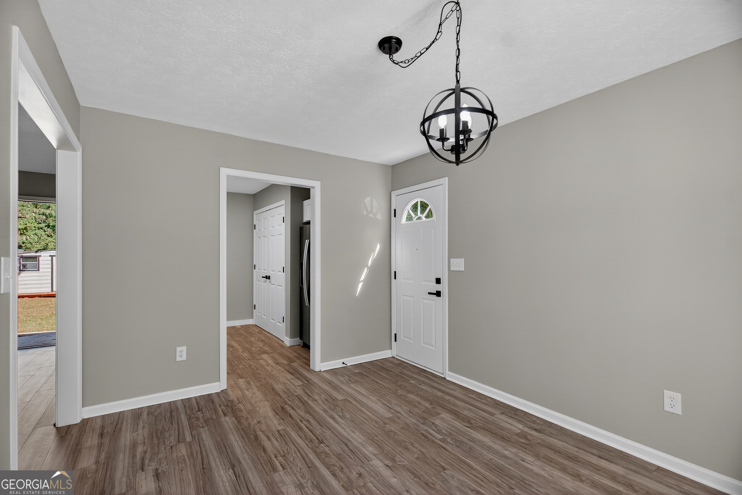 105 Ridgefield Drive LaGrange, GA 30241 - Photo 8 of 18 a view of an empty room with wooden floor and a window