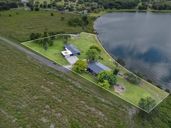 a view of a lake with a yard