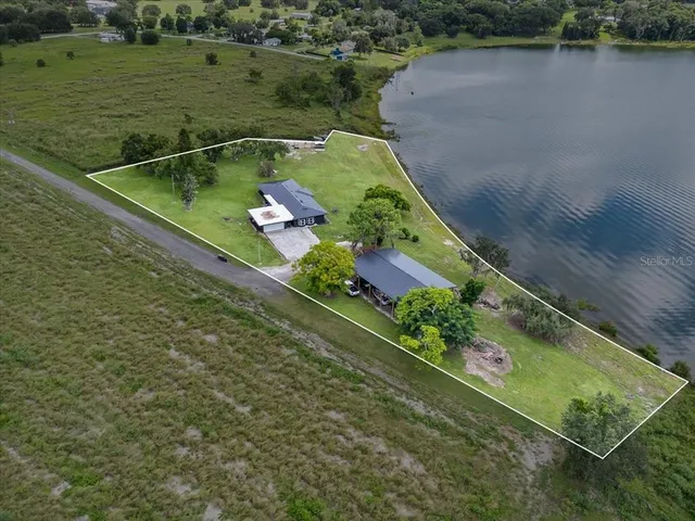 a view of a lake with a yard