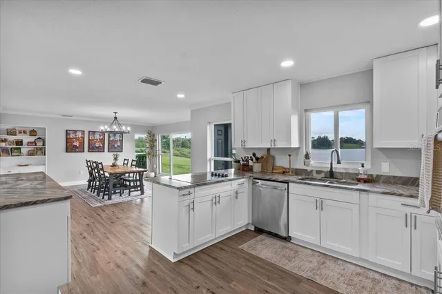 a kitchen with a sink and cabinets