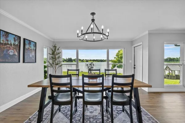 a dining room with furniture and window