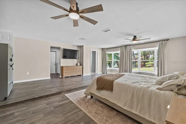 a spacious bathroom with a double vanity sink mirror and toilet