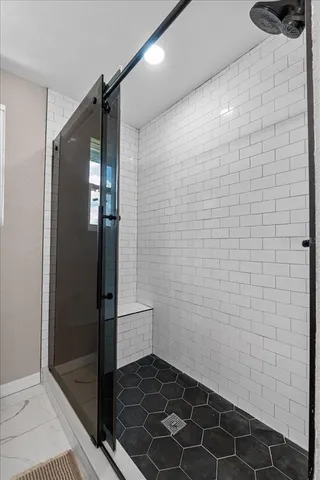 a view of a room with wooden floor