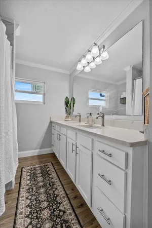 a bathroom with a sink a vanity and a mirror