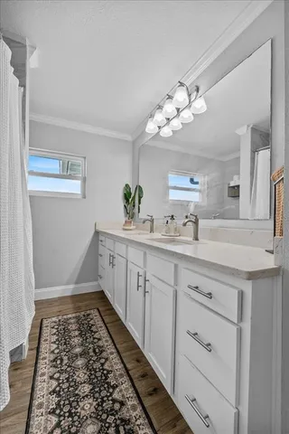 a bathroom with a sink a vanity and a mirror