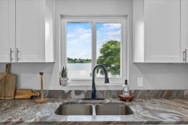 a kitchen with a sink and a window