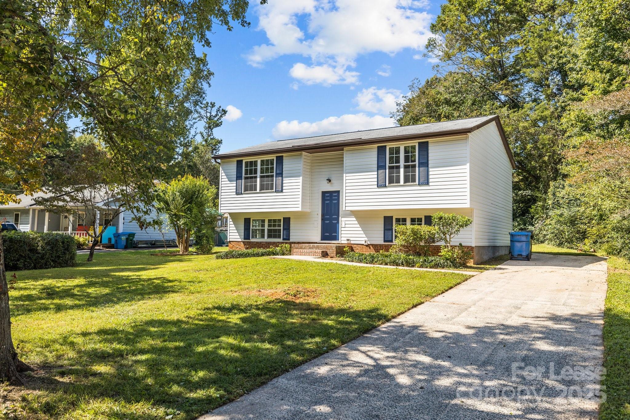 7120 Clear Crossing Lane Mint Hill, NC 28227 - Photo 1 of 27 a front view of a house with a garden