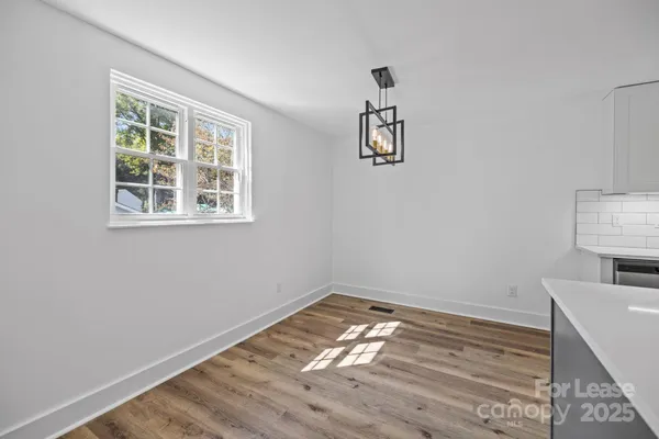 a room with a bed and a window