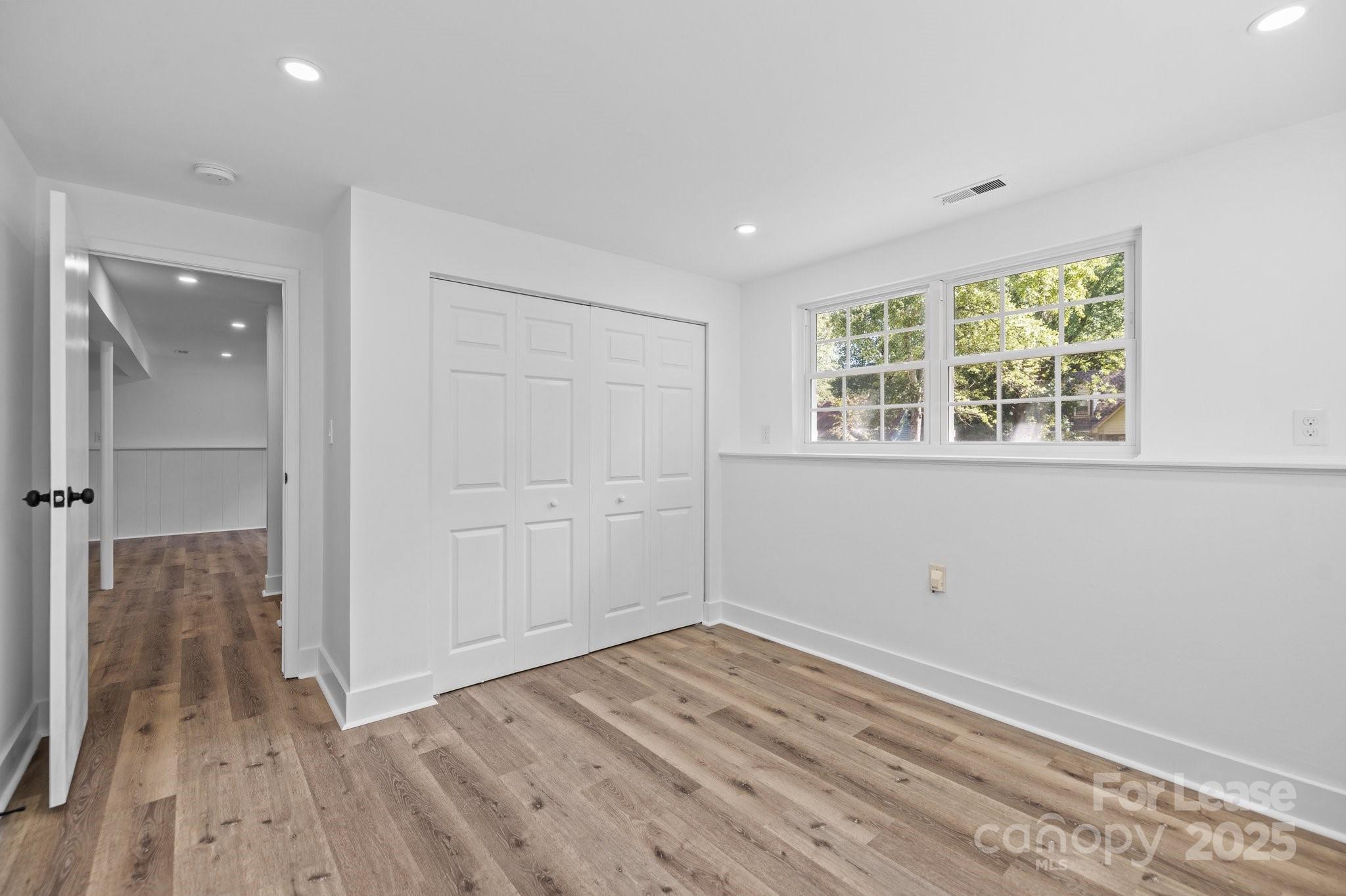 7120 Clear Crossing Lane Mint Hill, NC 28227 - Photo 20 of 27 wooden floor in an empty room with a window