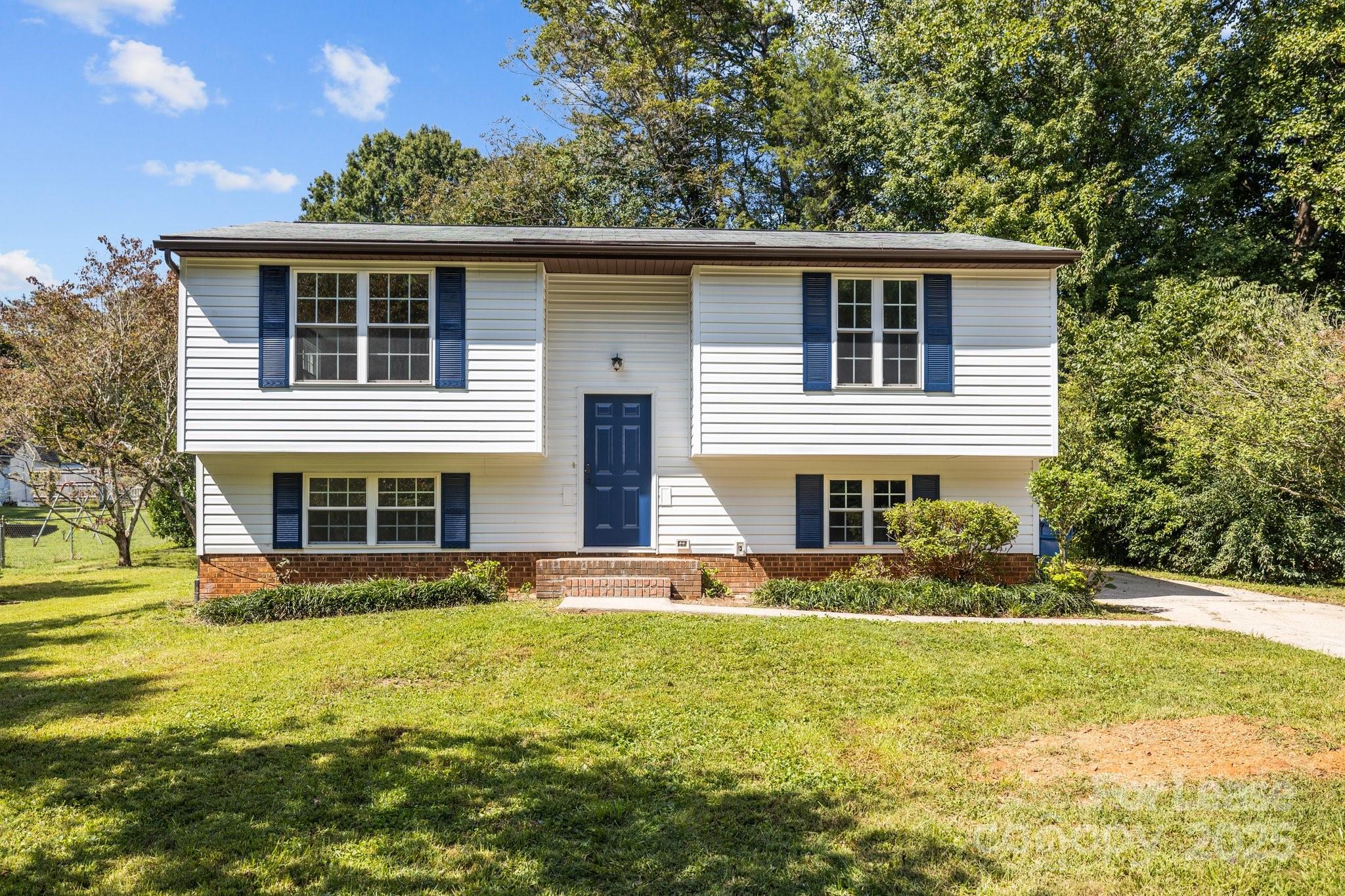 7120 Clear Crossing Lane Mint Hill, NC 28227 - Photo 2 of 27 a front view of house with yard and green space