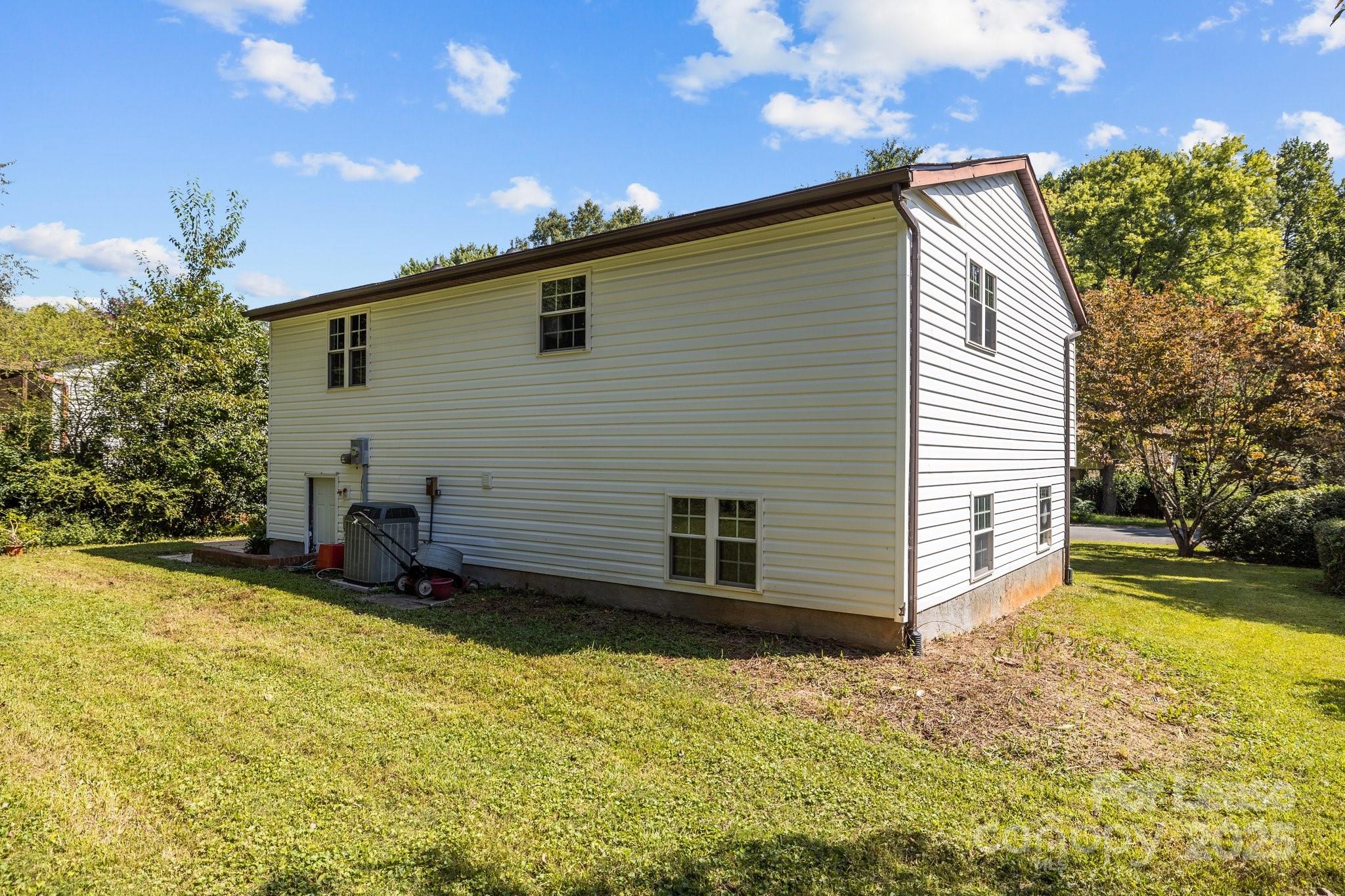 7120 Clear Crossing Lane Mint Hill, NC 28227 - Photo 26 of 27 a view of a backyard with a large tree