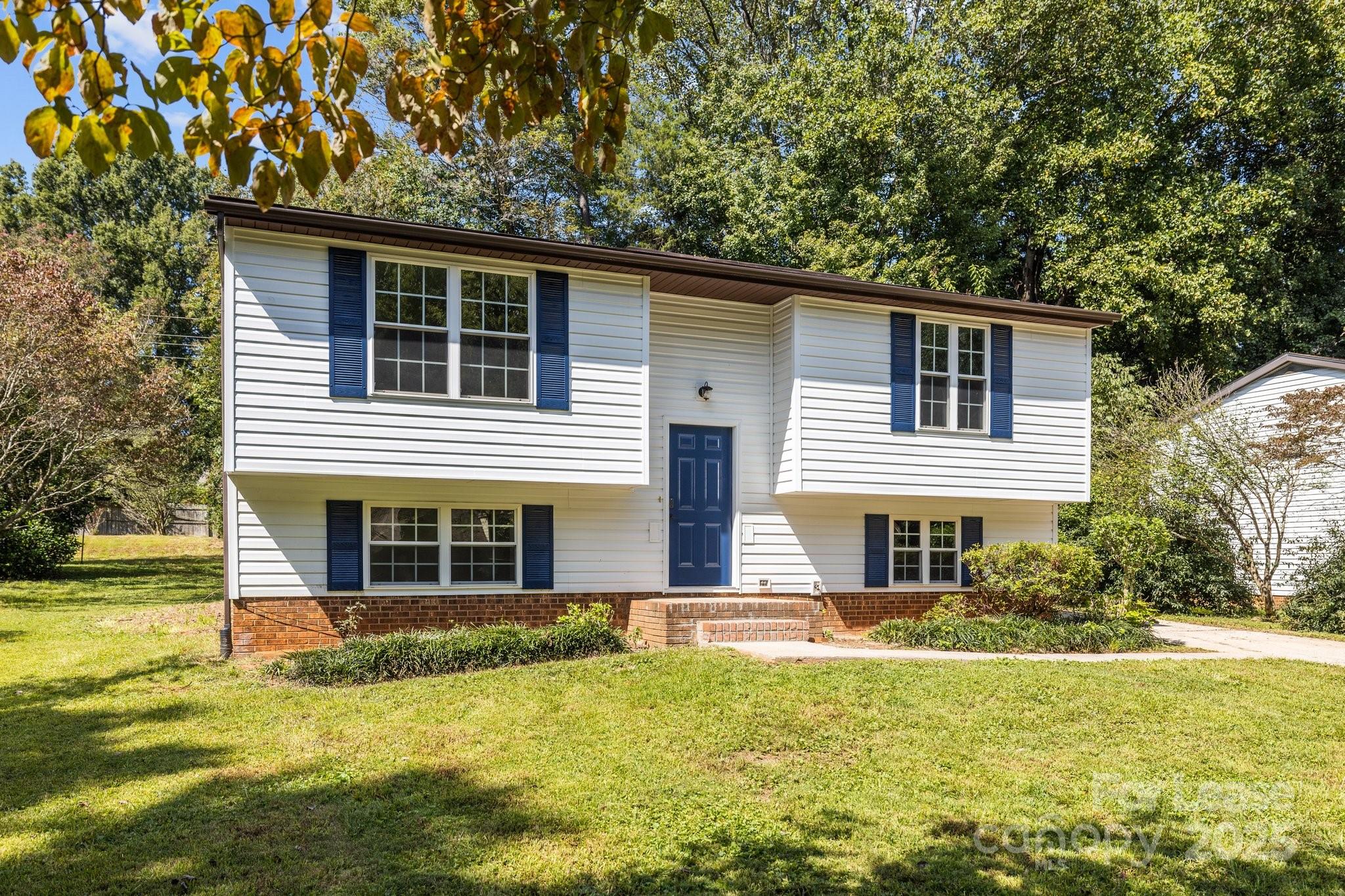 7120 Clear Crossing Lane Mint Hill, NC 28227 - Photo 3 of 27 a front view of a house with a yard