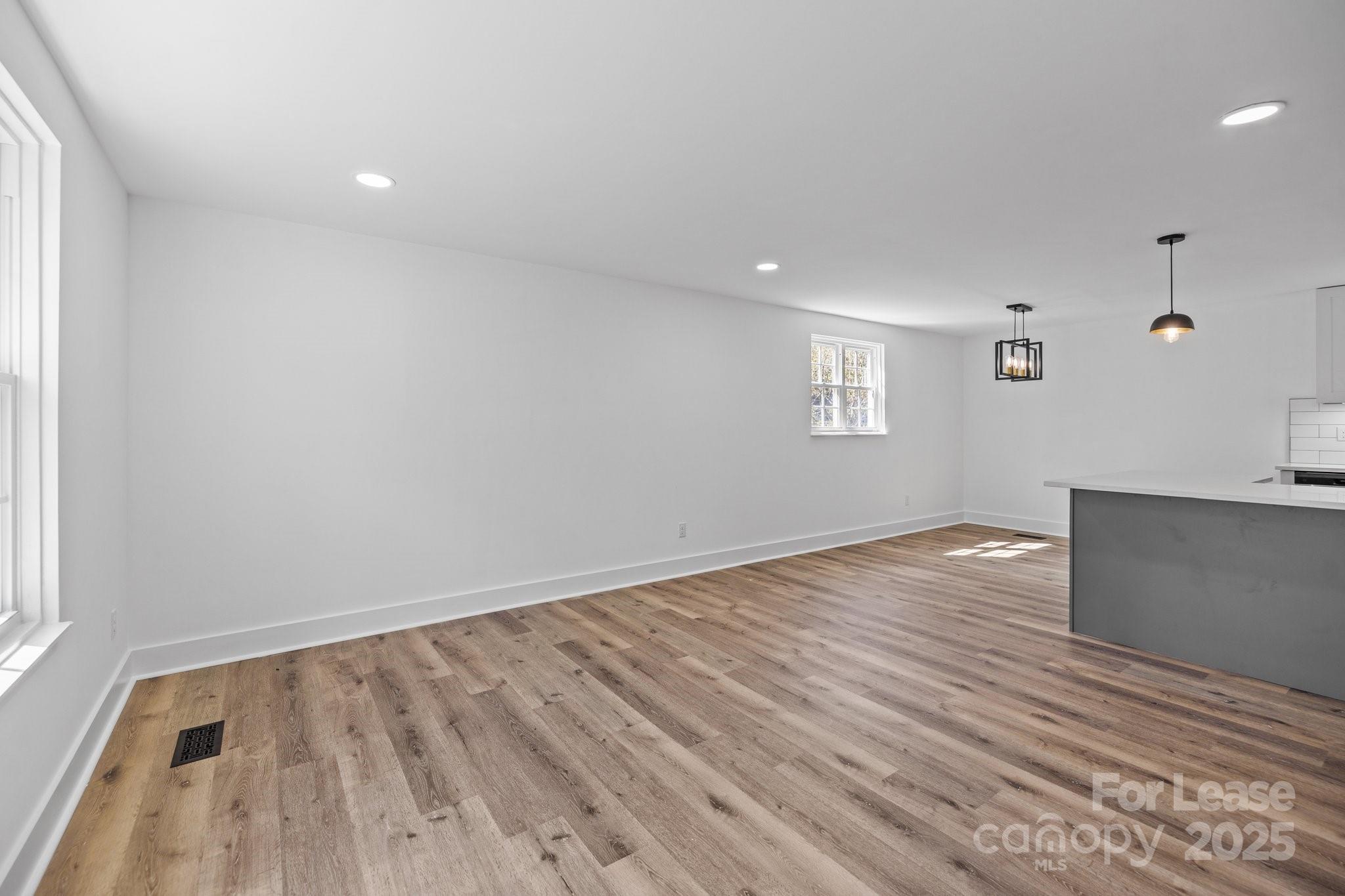 7120 Clear Crossing Lane Mint Hill, NC 28227 - Photo 6 of 27 wooden floor in an empty room with a window
