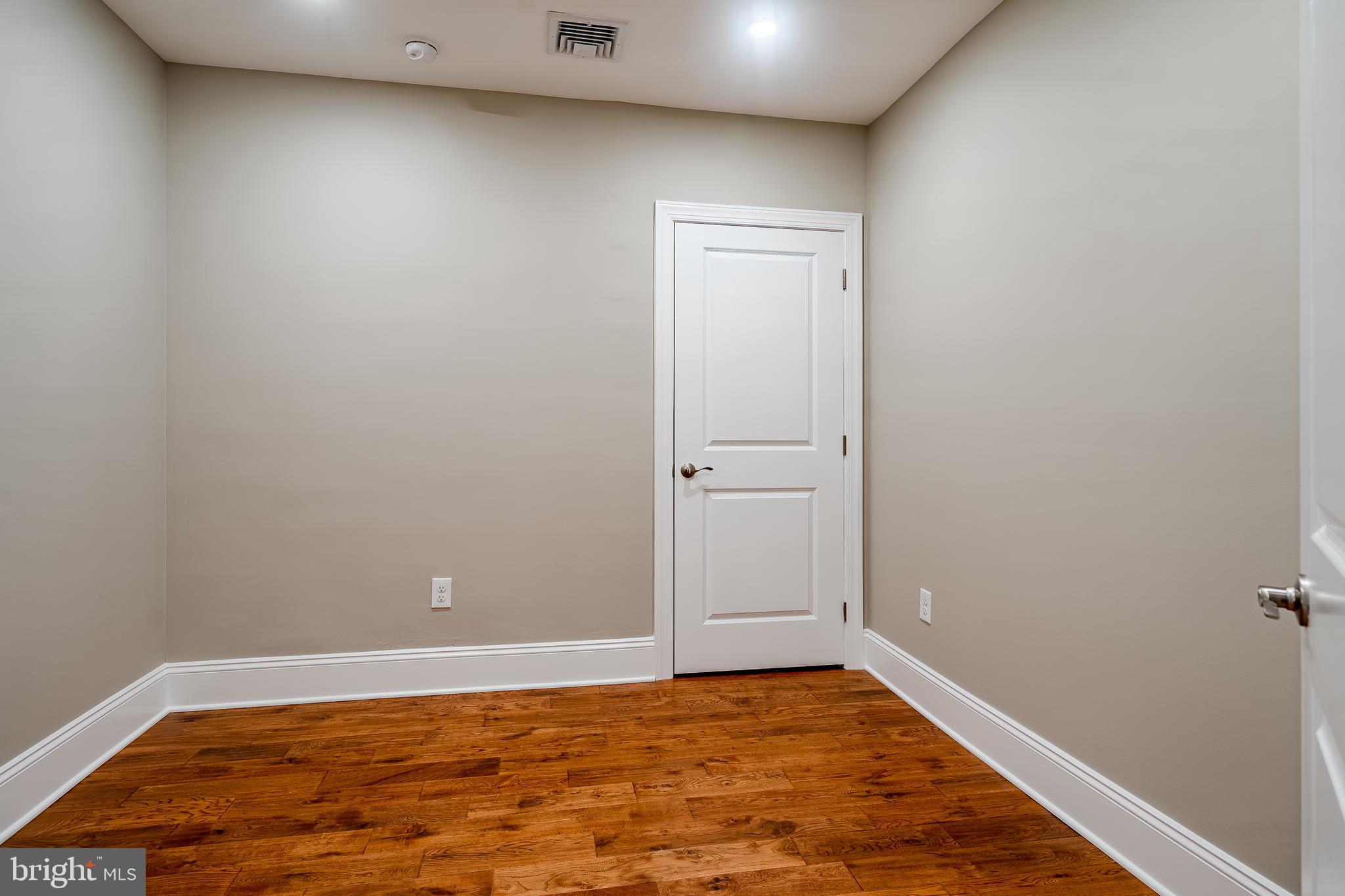 226 Bridge Street, Unit 2 Phoenixville, PA 19460 - Photo 17 of 25 a view of an empty room with wooden floor and closet