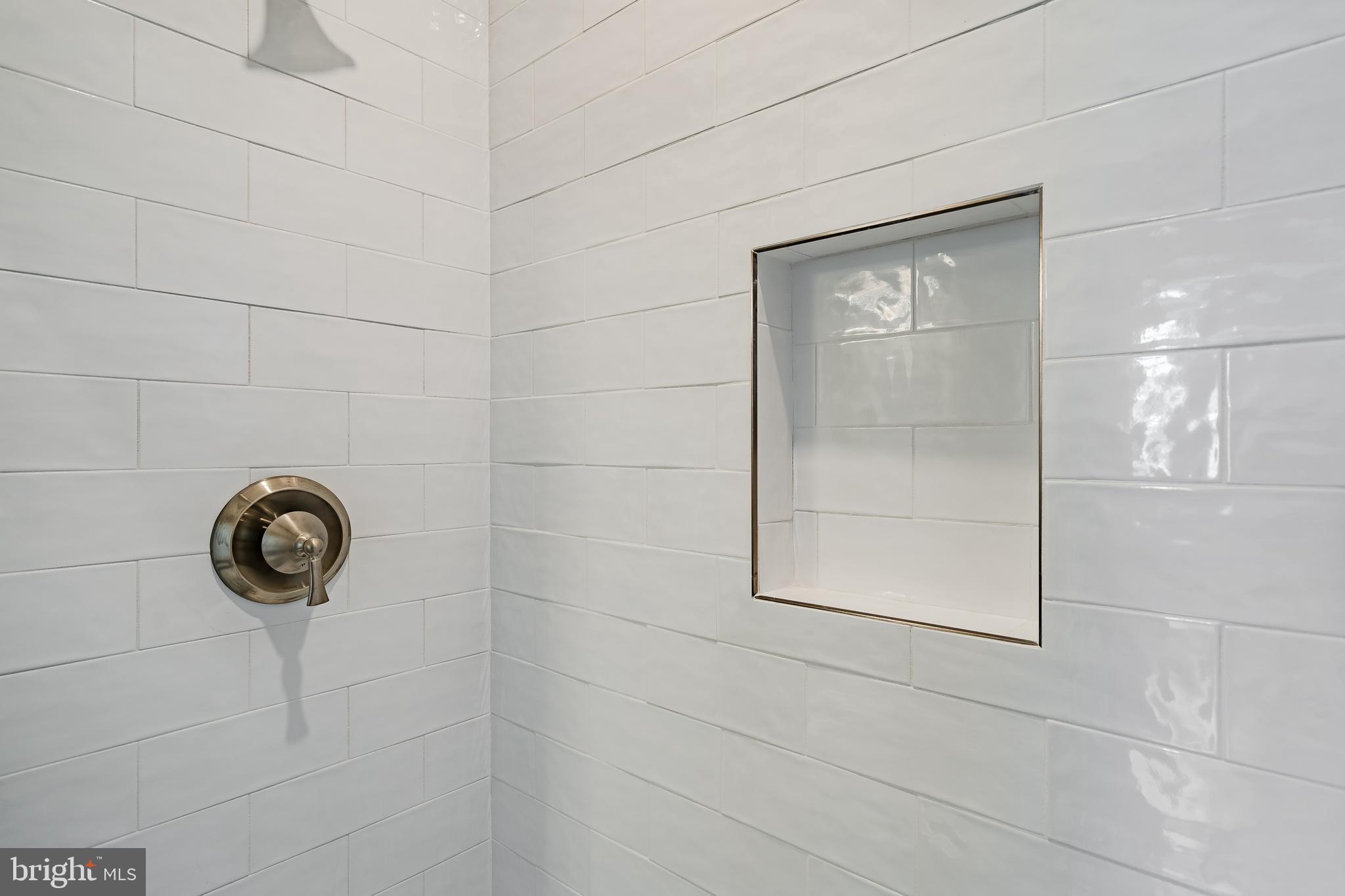 226 Bridge Street, Unit 2 Phoenixville, PA 19460 - Photo 20 of 25 a bathroom with a shower and mirror