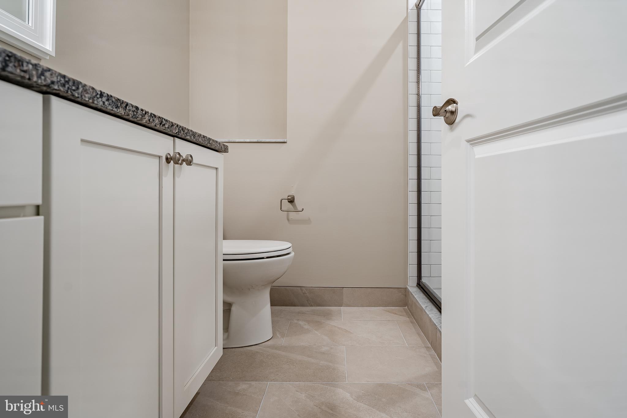 226 Bridge Street, Unit 2 Phoenixville, PA 19460 - Photo 22 of 25 a bathroom with a sink and a toilet