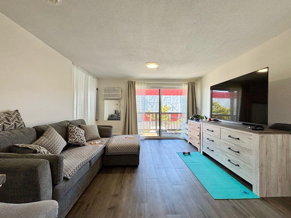 175 Ward Street, Unit 35 Revere, MA 02151 - Photo 1 of 19 a living room with furniture and a flat screen tv