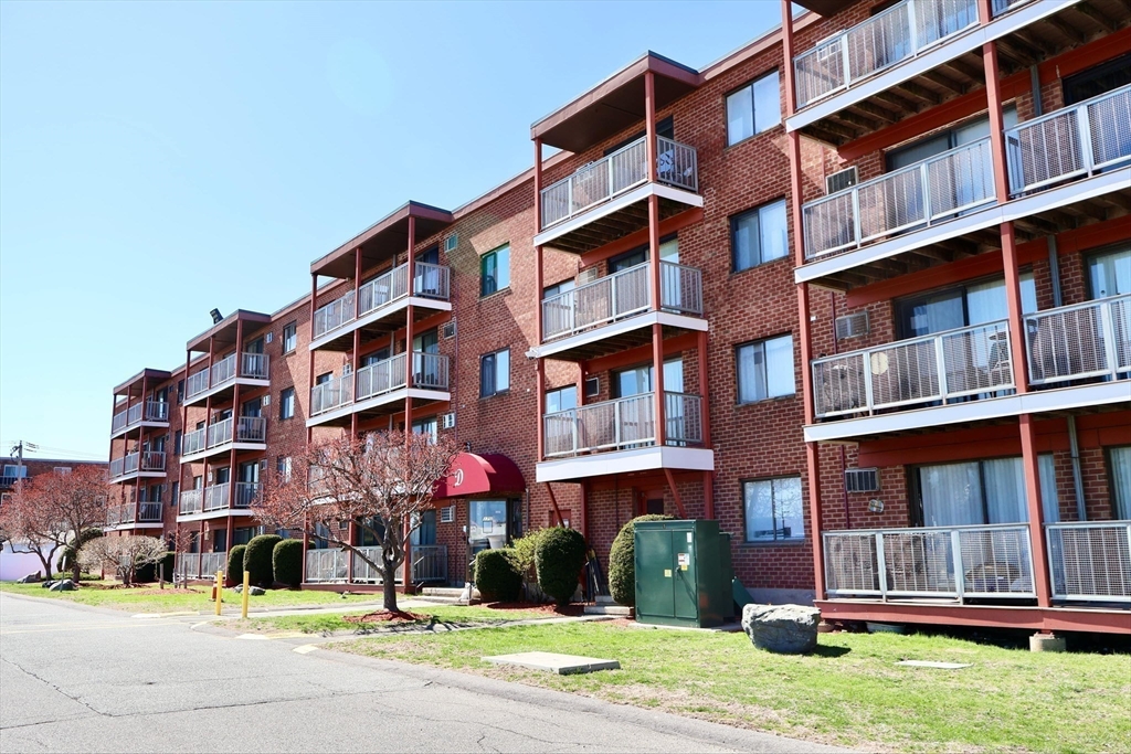 175 Ward Street, Unit 35 Revere, MA 02151 - Photo 16 of 19 a view of building with a yard