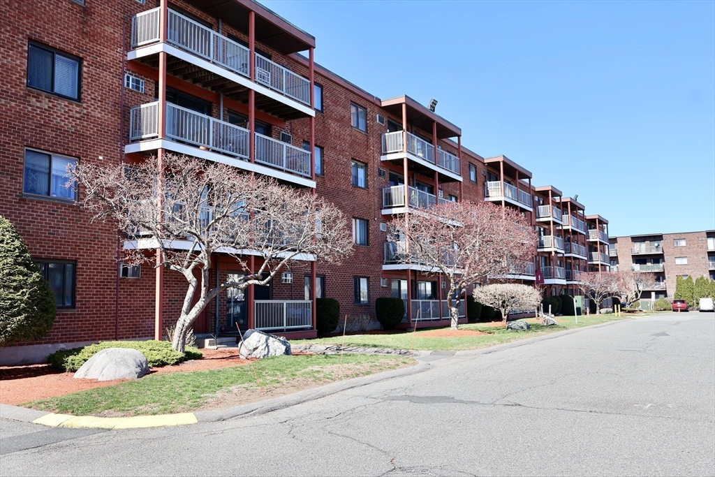 175 Ward Street, Unit 35 Revere, MA 02151 - Photo 18 of 19 a front view of a building with a yard