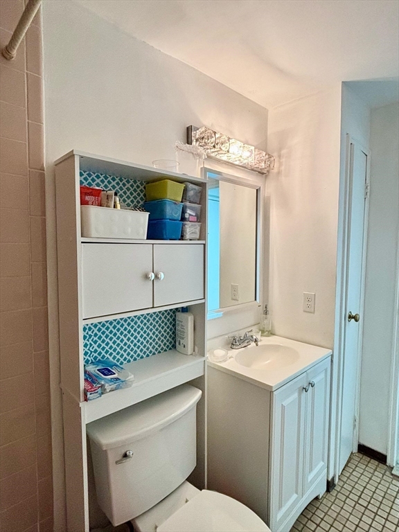 175 Ward Street, Unit 35 Revere, MA 02151 - Photo 6 of 19 a bathroom with a sink a toilet and mirror