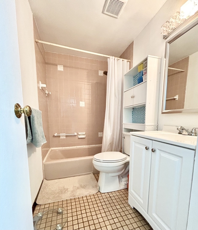 175 Ward Street, Unit 35 Revere, MA 02151 - Photo 7 of 19 a bathroom with a sink toilet a shower and a mirror