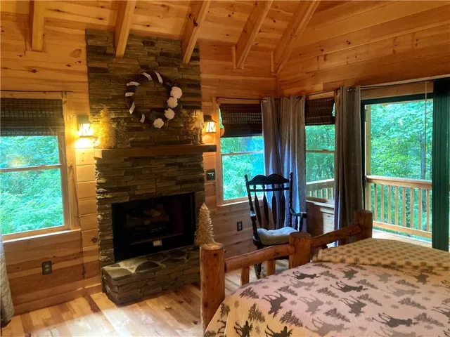 a bed sitting in a bedroom next to a window