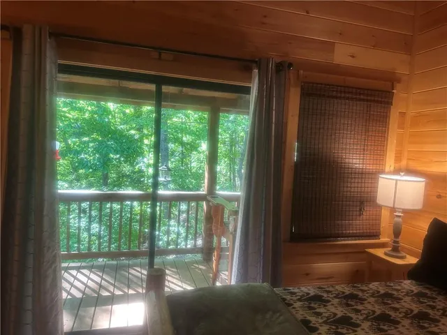 a bedroom with a bed and a tv