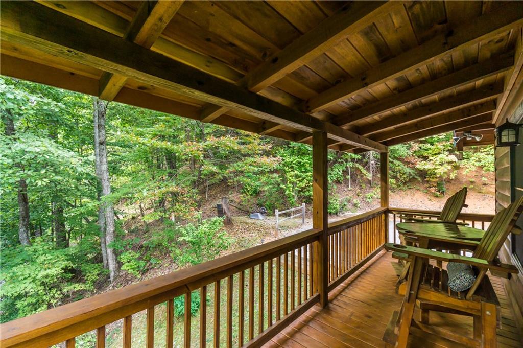 105 Ranch Mountain Court Dahlonega, GA 30533 - Photo 14 of 70 a view of a two chair in the balcony next to a yard