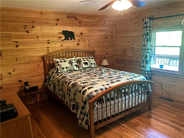 a living room with furniture a rug and a table