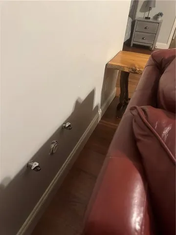 a wooden bench sitting in backside of a house