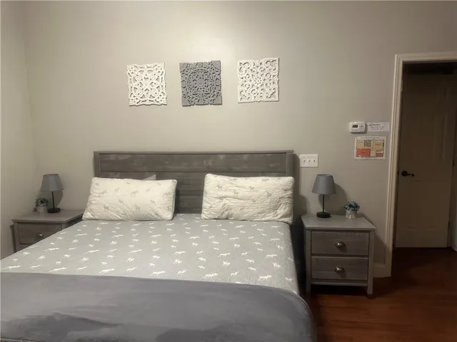 a backyard of a house with a garden and outdoor seating