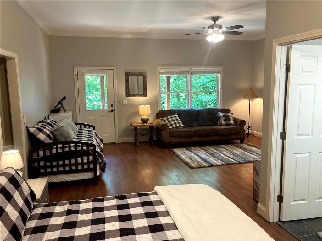 105 Ranch Mountain Court Dahlonega, GA 30533 - Photo 38 of 70 a living room with furniture and a large window