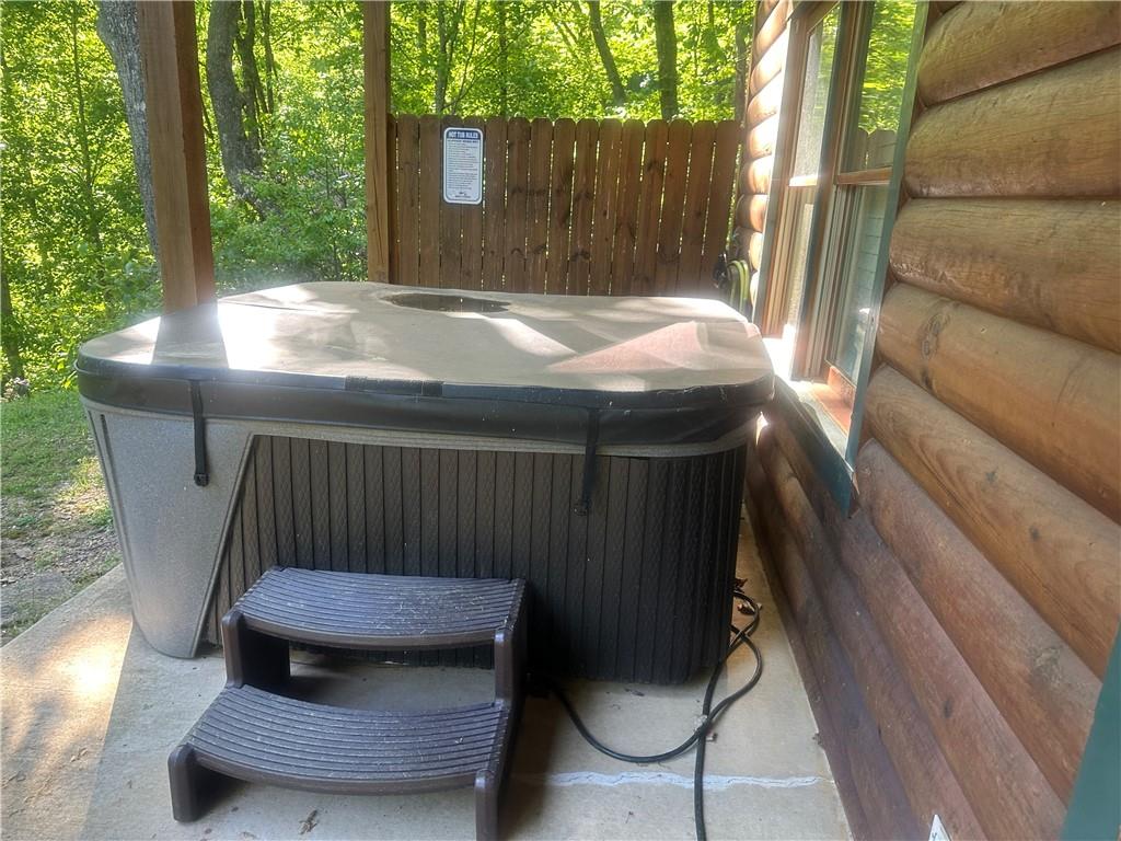 105 Ranch Mountain Court Dahlonega, GA 30533 - Photo 48 of 70 a wooden bench sitting in backside of a house