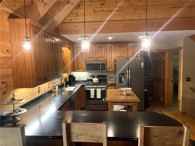 a living room with furniture a window and a fireplace