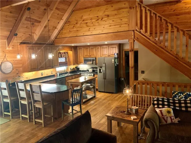 a view of a two chair in the balcony next to a yard