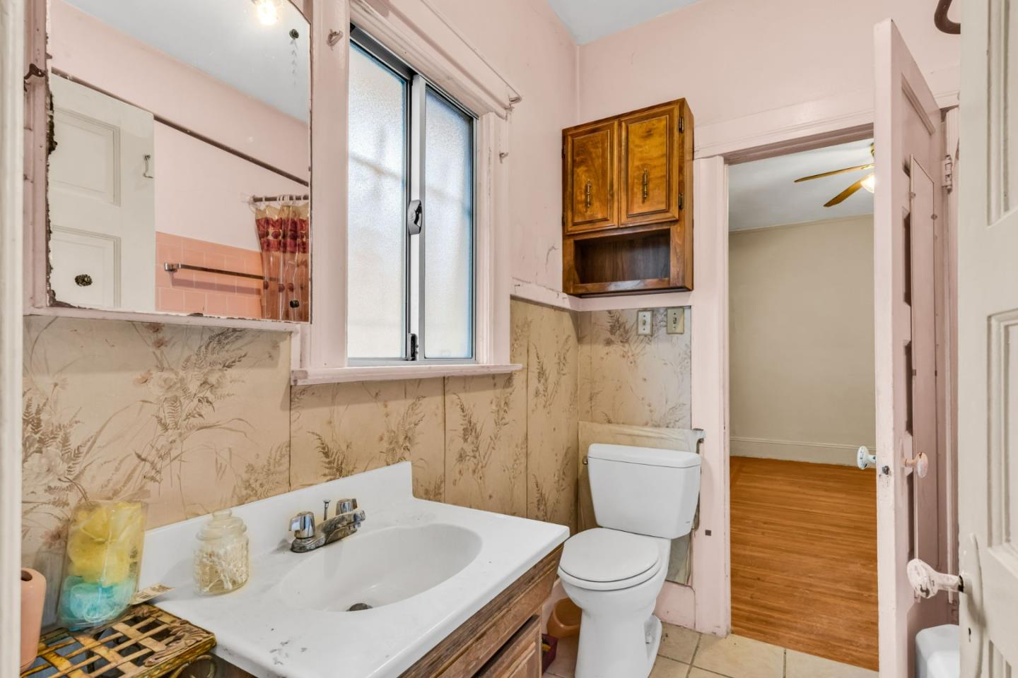 852 58th Street Oakland, CA 94608 - Photo 19 of 64 a bathroom with a sink toilet and shower