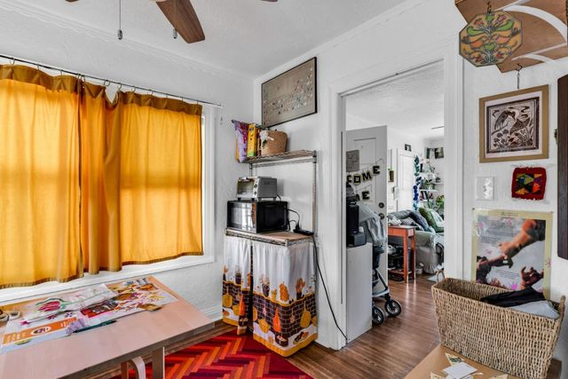 a bathroom with a sink a toilet and shower curtain