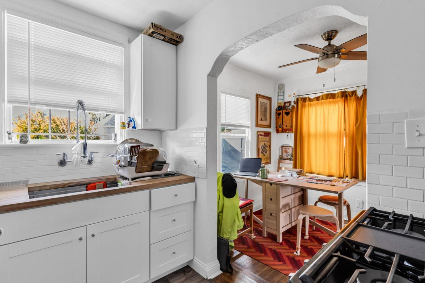 852 58th Street Oakland, CA 94608 - Photo 38 of 64 a kitchen with stainless steel appliances a sink a stove and a window