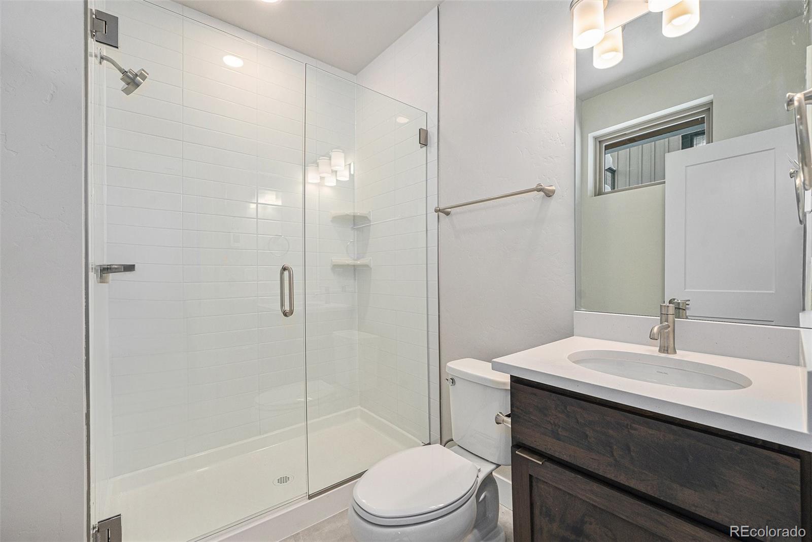 15 Explorers Avenue Fraser, CO 80442 - Photo 14 of 25 a bathroom with a sink toilet and shower