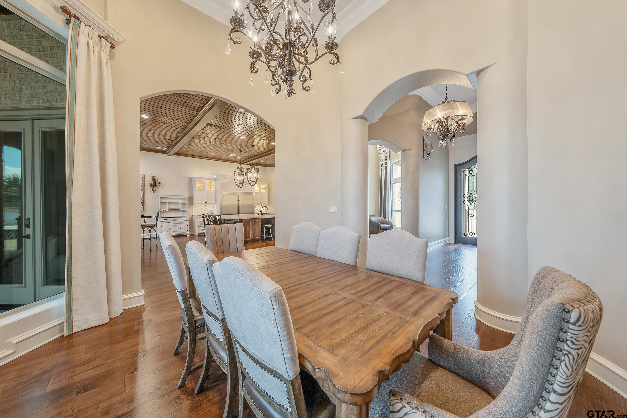 13793 Peninsula Road Whitehouse, TX 75791 - Photo 16 of 48 a view of a dining room with furniture and wooden floor