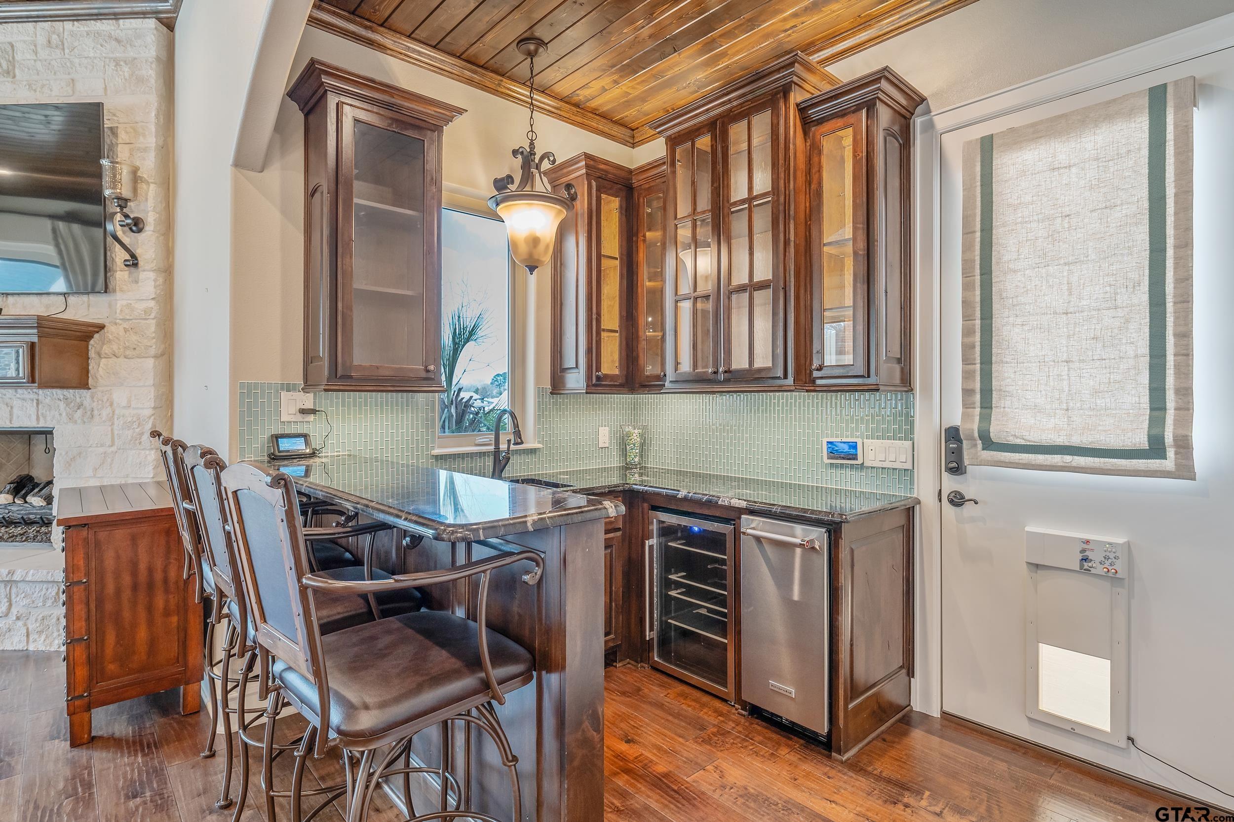 13793 Peninsula Road Whitehouse, TX 75791 - Photo 18 of 48 a view of a kitchen with table and chairs