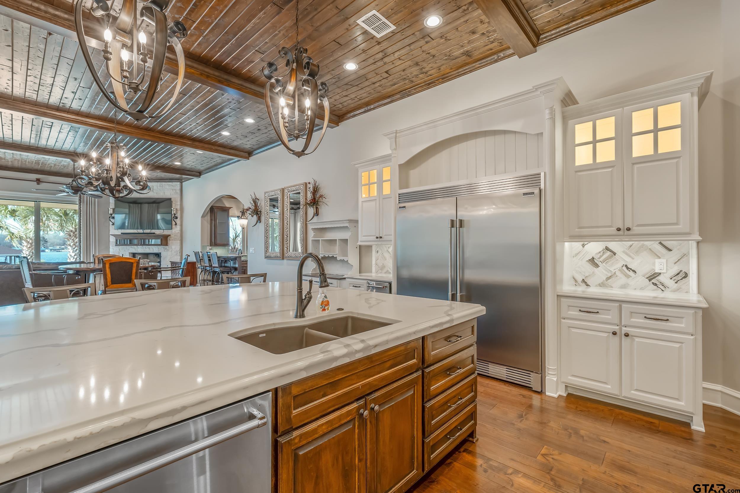 13793 Peninsula Road Whitehouse, TX 75791 - Photo 21 of 48 a kitchen with stainless steel appliances granite countertop a sink a stove and a refrigerator
