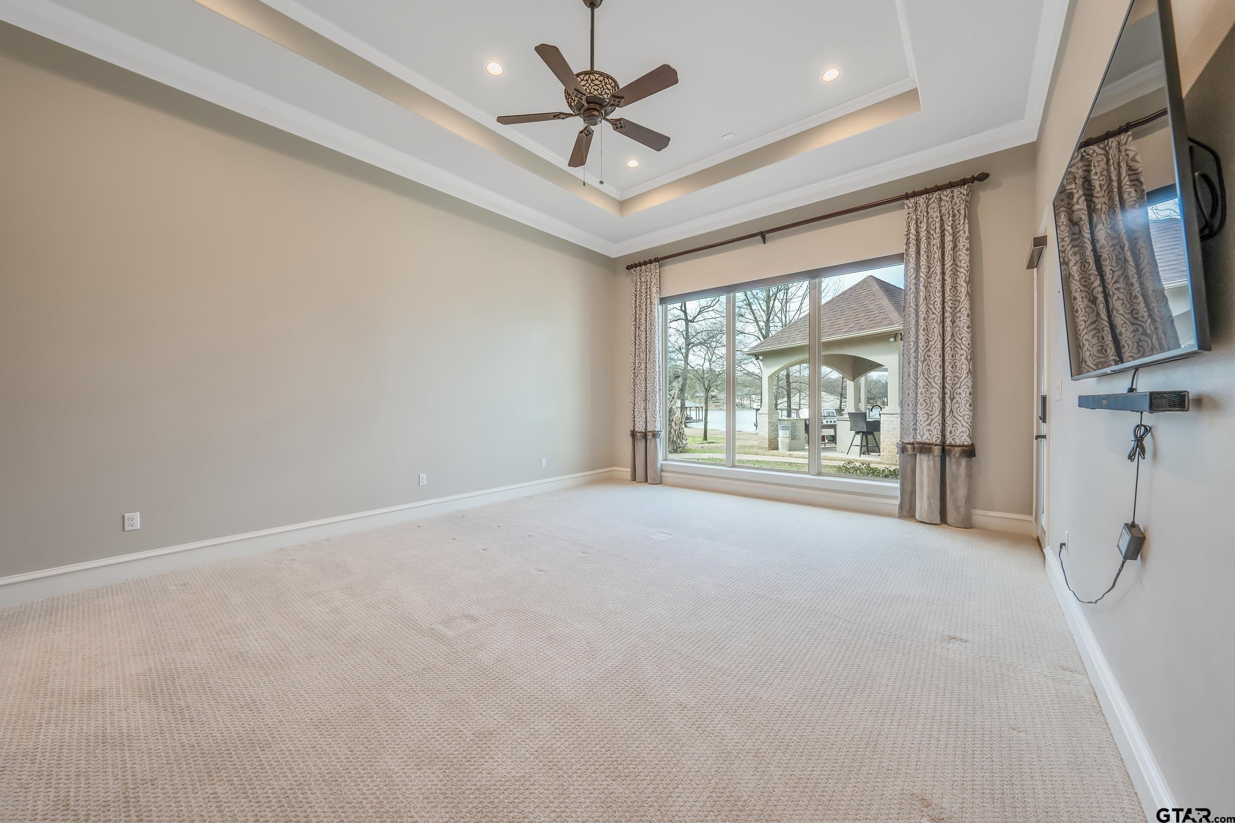 13793 Peninsula Road Whitehouse, TX 75791 - Photo 27 of 48 en empty room with windows and ceiling fan