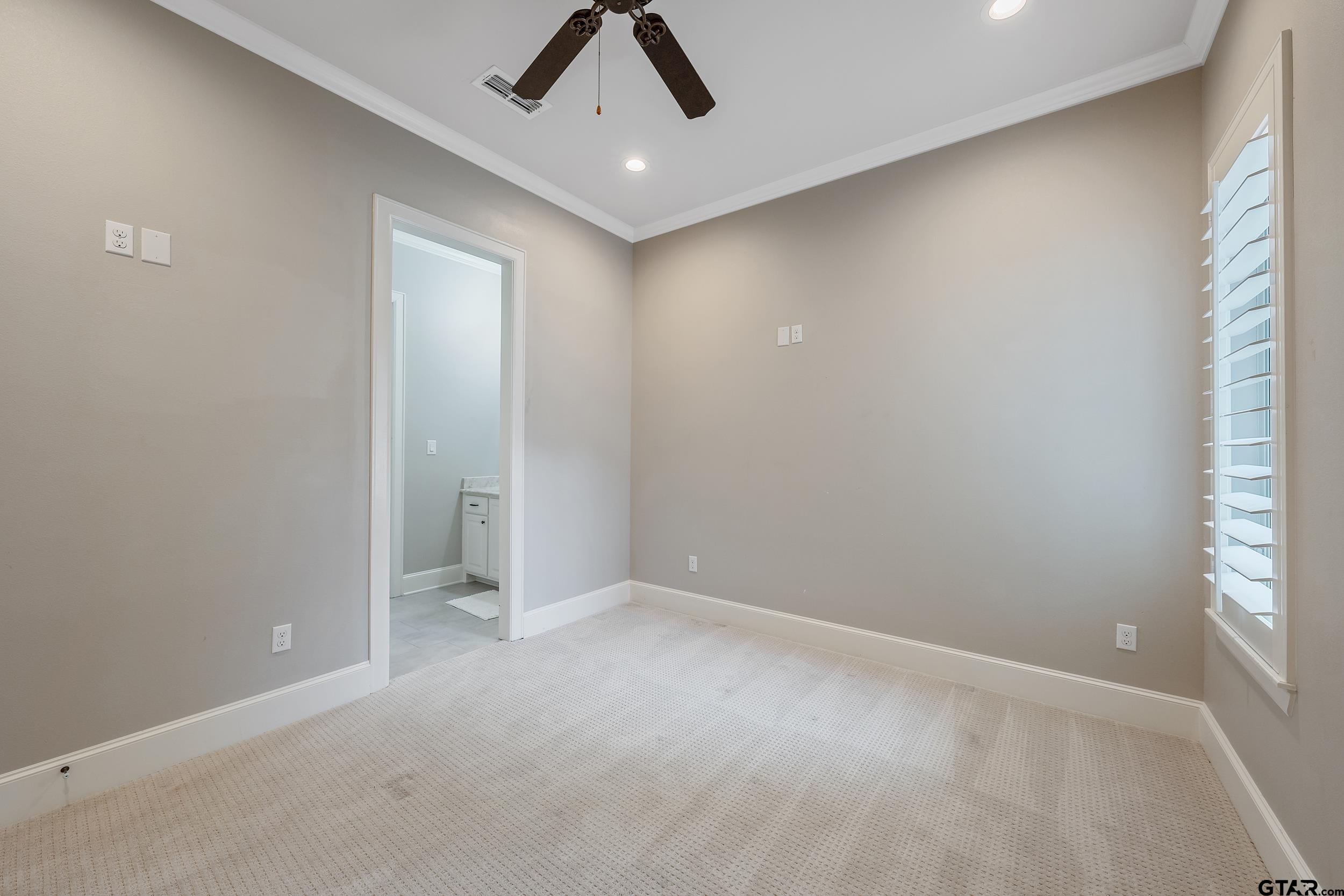 13793 Peninsula Road Whitehouse, TX 75791 - Photo 29 of 48 an empty room with a ceiling fan and window
