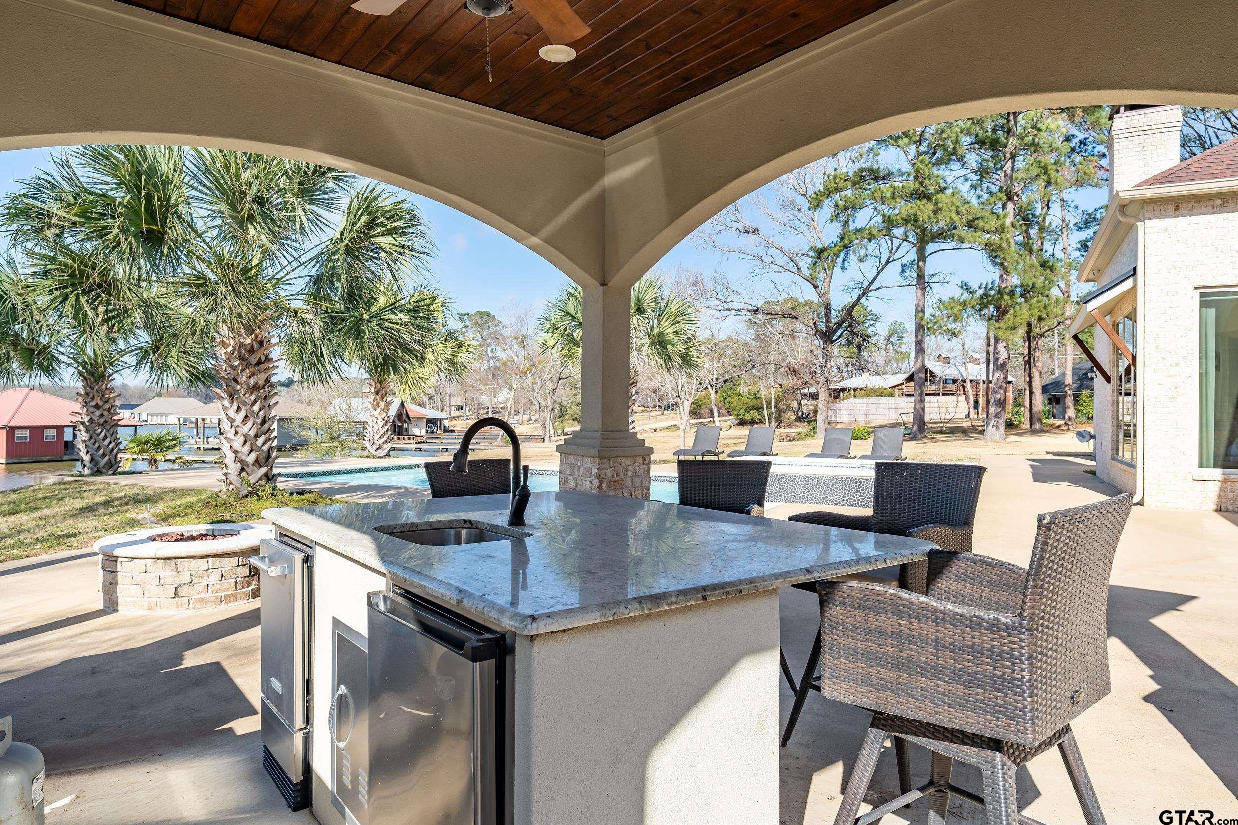 13793 Peninsula Road Whitehouse, TX 75791 - Photo 36 of 48 a kitchen with a table chairs and a stove