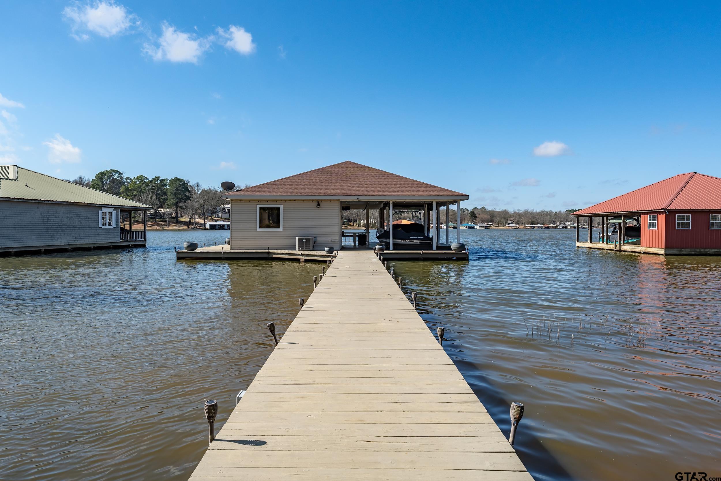 13793 Peninsula Road Whitehouse, TX 75791 - Photo 41 of 48 a view of a house with wooden deck